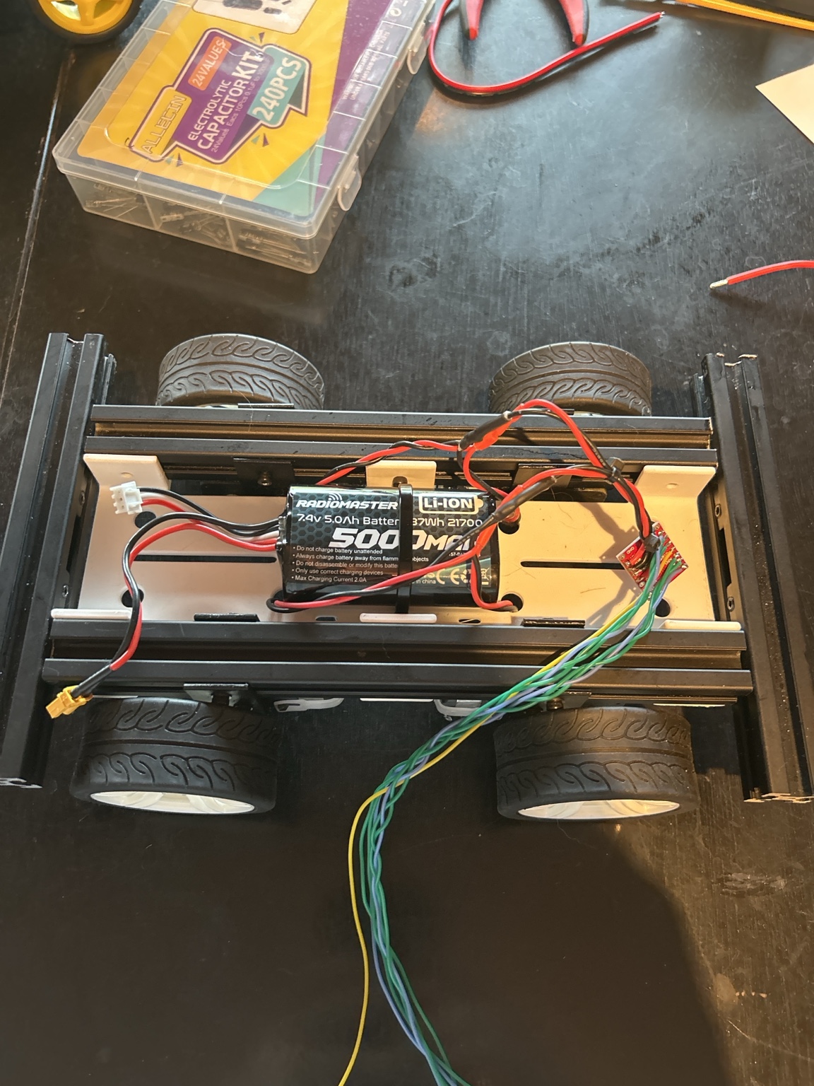 Rover-001b chassis with Arduino, battery, and modular wiring